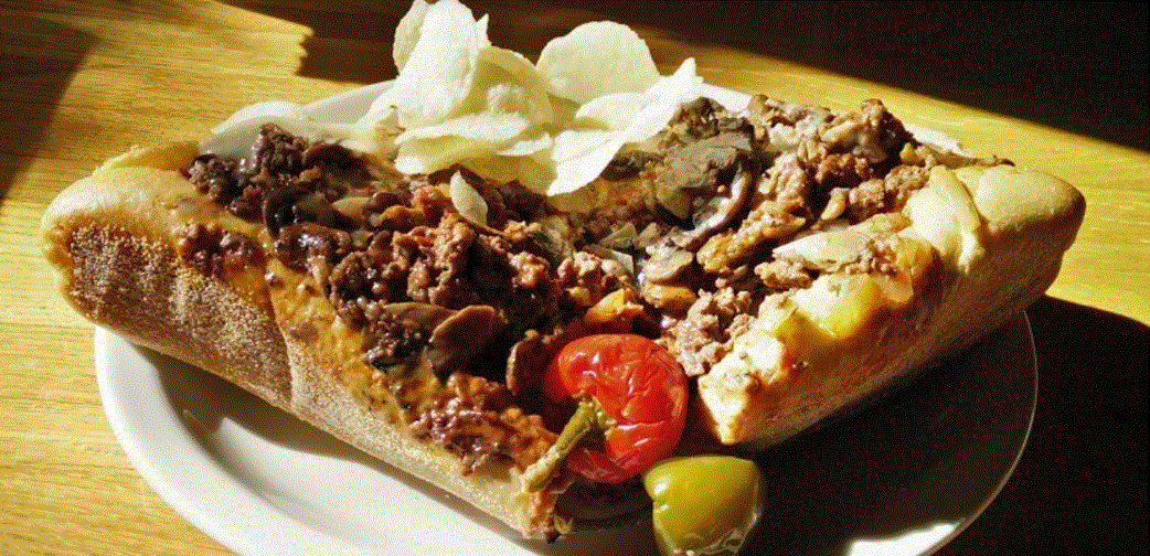 Relaxed, cash-only eatery serving pizza & sandwiches in a space with fireplaces & red-oak walls.