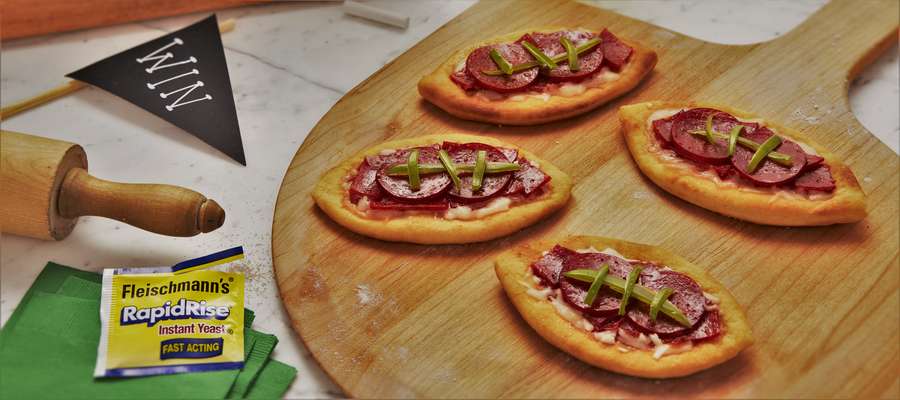 Football Pizza - Transform your favorite pepperoni pizza into a football for the next big game.