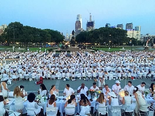Originally started 30 years ago with just a handful of friends by François Pasquier nearly 30 years ago, Le Dîner en Blanc® de Paris now assembles over 10,000 guest every year, with a record 15,000 people attending the 25th anniversary in 2013. The French capital’s most prestigious sites have played host the event over the years. Le Dîner en Blanc® began as a strictly word-of-mouth event. Today, it has grown to rely on the Internet and social media to communicate with its members and others who are curious about the event. Although the technology behind this fantastic event may have changed over the years, the principles fueling it have not; guests continue to gather at a secret location with the sole purpose of sharing a gourmet meal with good friends at the heart of one of their city’s most beautiful locations.