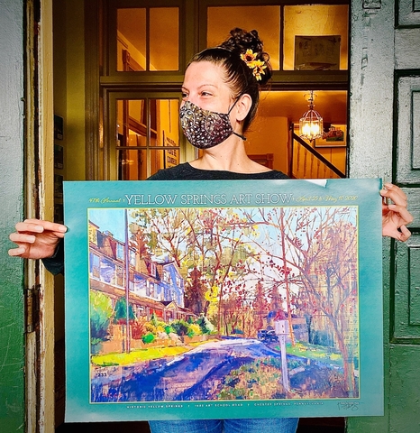 Jess Presley, Marketing and Events Coordinator, displays 2020 Art Show Poster Competition Winner 'Quiet' by Teresa Haag